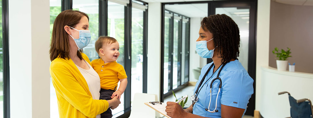 Family at hospital wearing masks