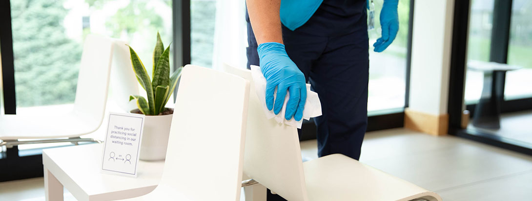 Trained cleaning technician cleaning a chair